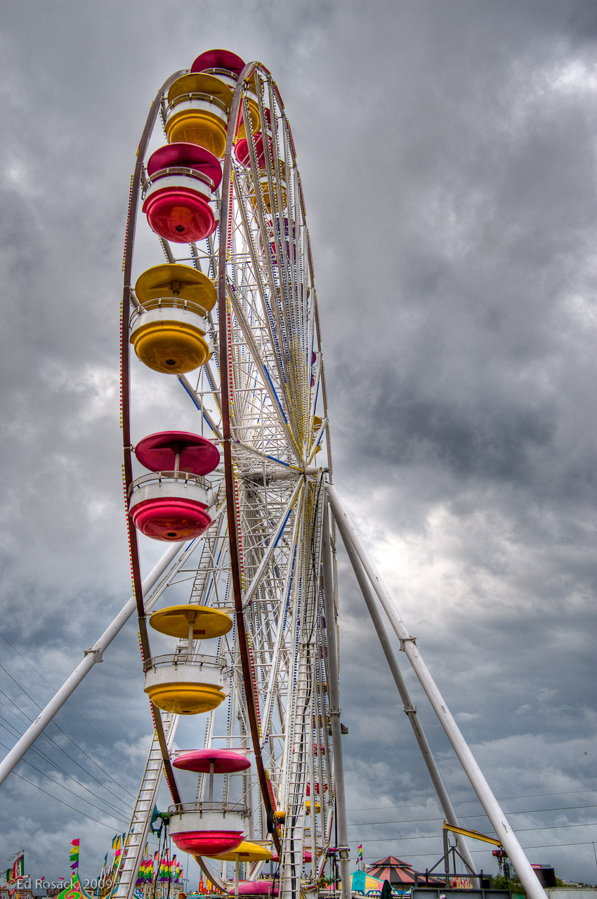 Ferris wheel and Storm clouds- This photo is one of the first images I made with my D700.  It's a photo of a Ferris wheel in the parking lot at a local mall against the morning storm clouds. Hopefully the storm cleared before evening or not too many people were at the fair.