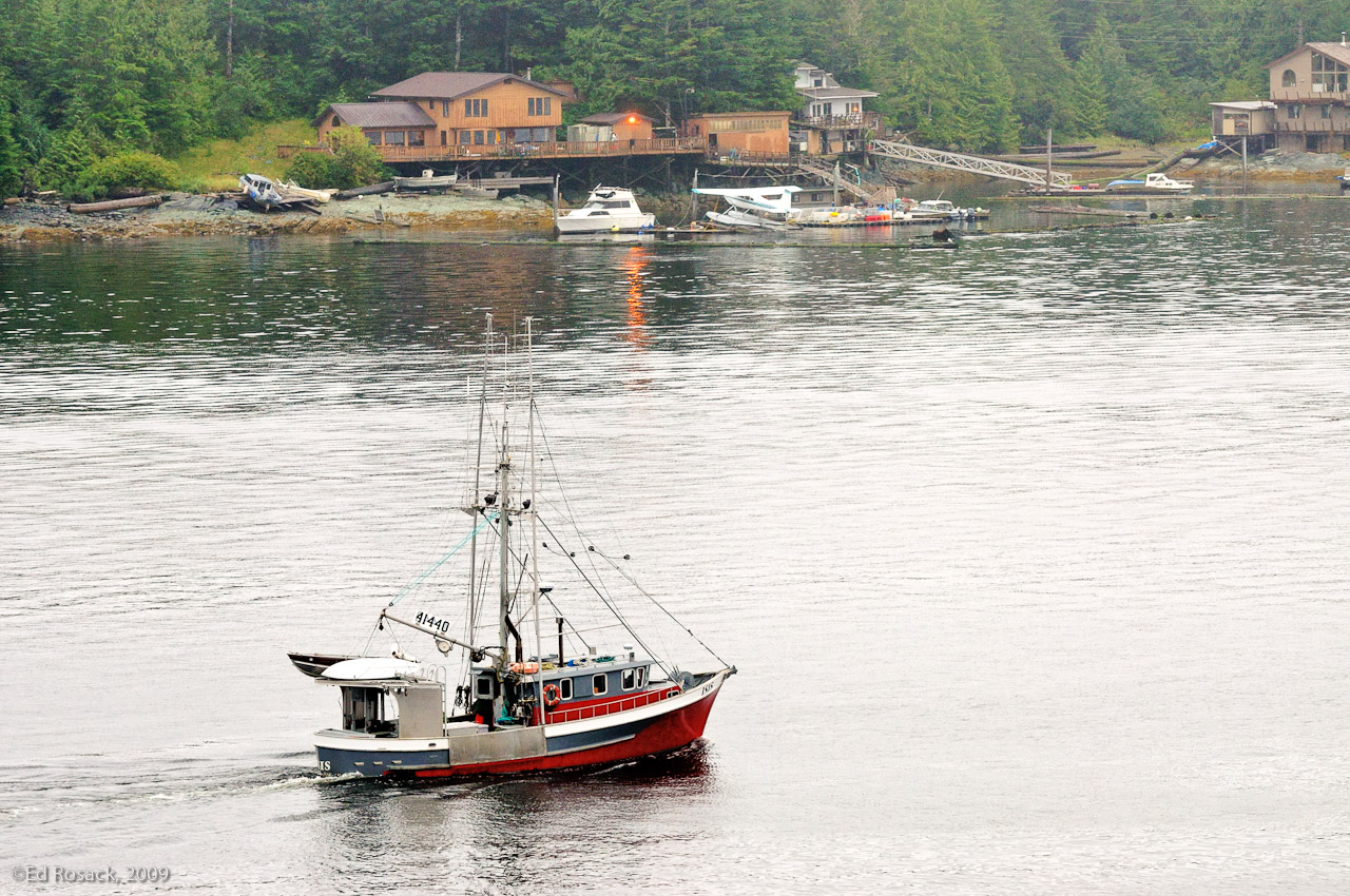 Ketchikan harbor- Ketchikan trawler Isis and house in the background with a parked float plane.